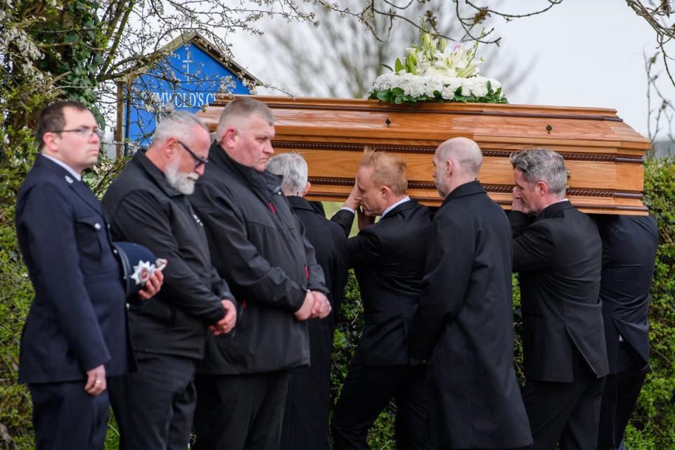 The coffin of Paul O’Grady is carried into the church in Aldington, Kent (Getty)