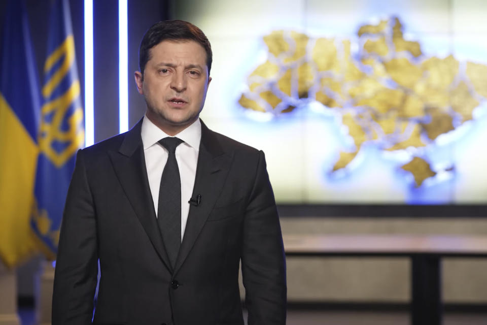 FILE - In this photo taken from video provided by the Ukrainian Presidential Press Office, Ukrainian President Volodymyr Zelenskyy addresses the nation in Kyiv, Ukraine, Feb. 24, 2022. As milestones go, the first anniversary of Russia's invasion of Ukraine is both grim and vexing. It marks a full year of killing, destruction, loss and pain felt even beyond the borders of Russia and Ukraine. (Ukrainian Presidential Press Office via AP, File)