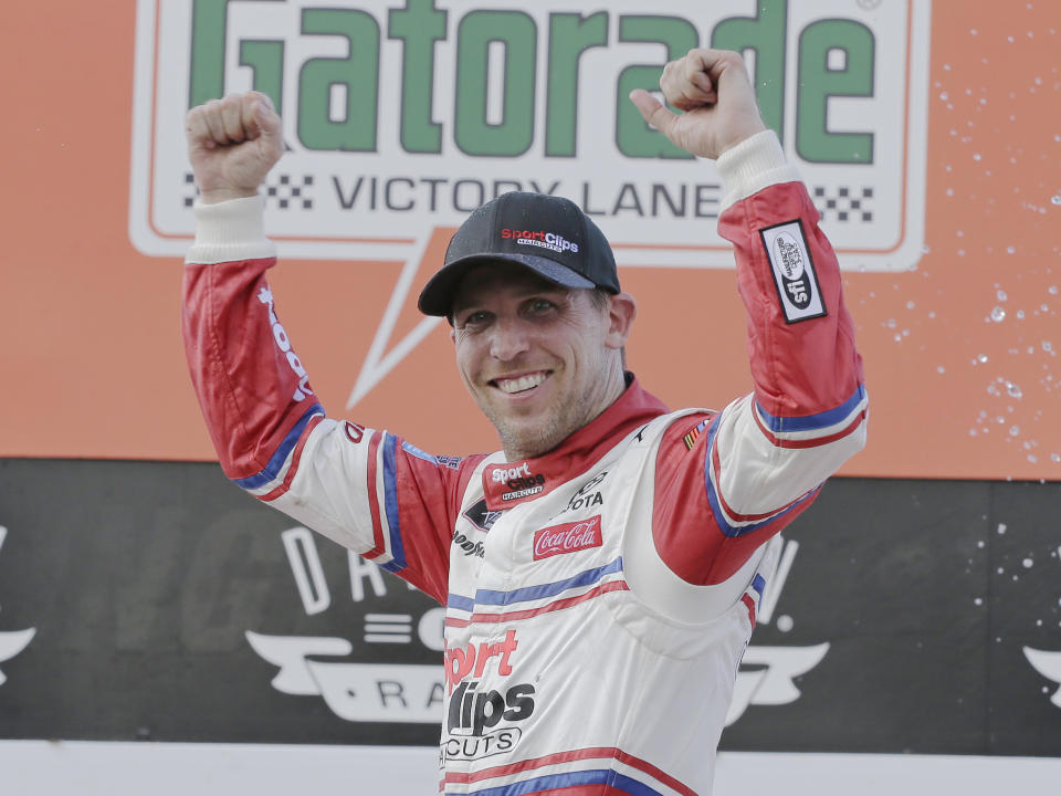 ADD HAMLIN STRIPPED OF WIN - Denny Hamlin celebrates in Victory Lane after winning a NASCAR Xfinity Series auto race on Saturday, Aug. 31, 2019, at Darlington Raceway in Darlington, S.C. Hamlin was stripped of his win after he failed post-race inspection. Cole Custer was declared the winner. (AP Photo/Terry Renna)