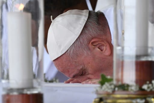 Pope Francis kissed the altar before leading the mass