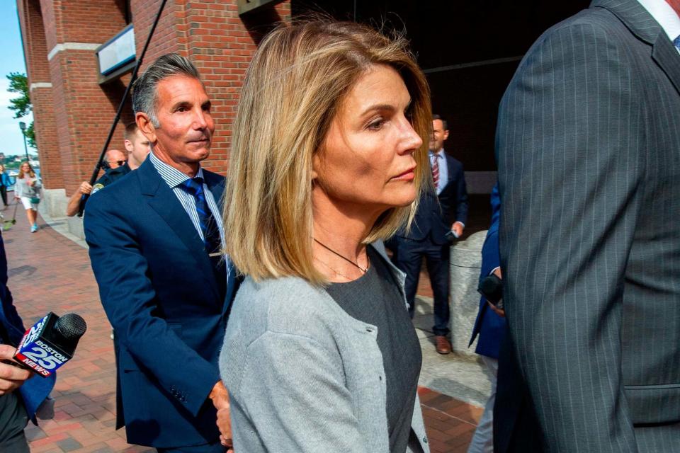 Lori Loughlin and husband Mossimo Giannulli (AFP via Getty Images)