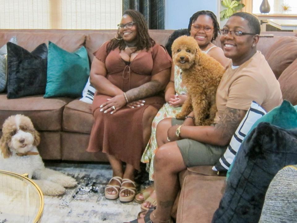 (From left) Tachina, Alyssia and Mallory, joined by their canine companions Sophia and Bentley, love their new home.