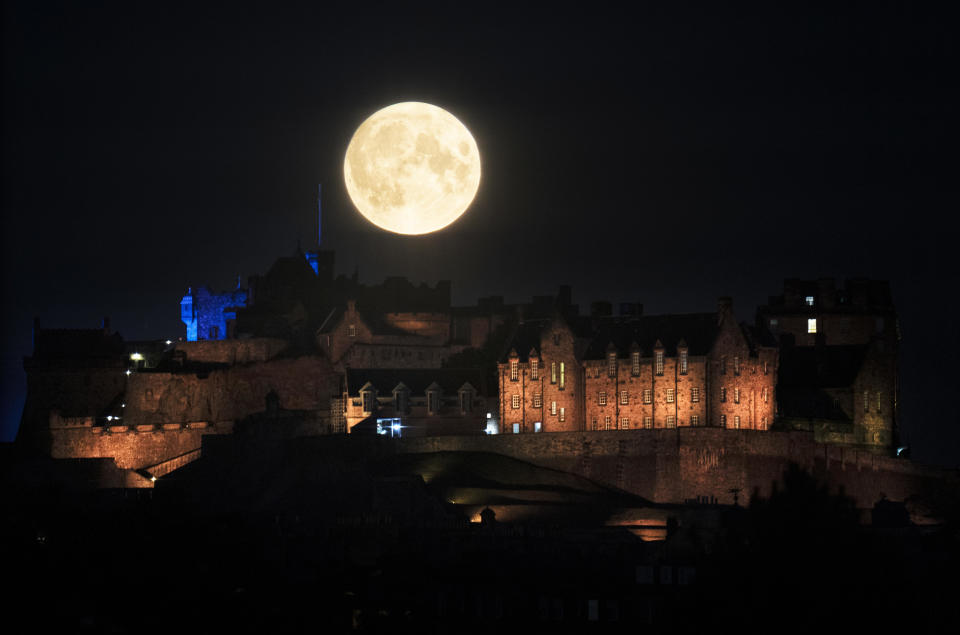 The Sturgeon supermoon, the final supermoon of the year, rises behind Edinburgh Castle. Picture date: Thursday August 11, 2022. / Credit: Jane Barlow/PA Images via Getty Images