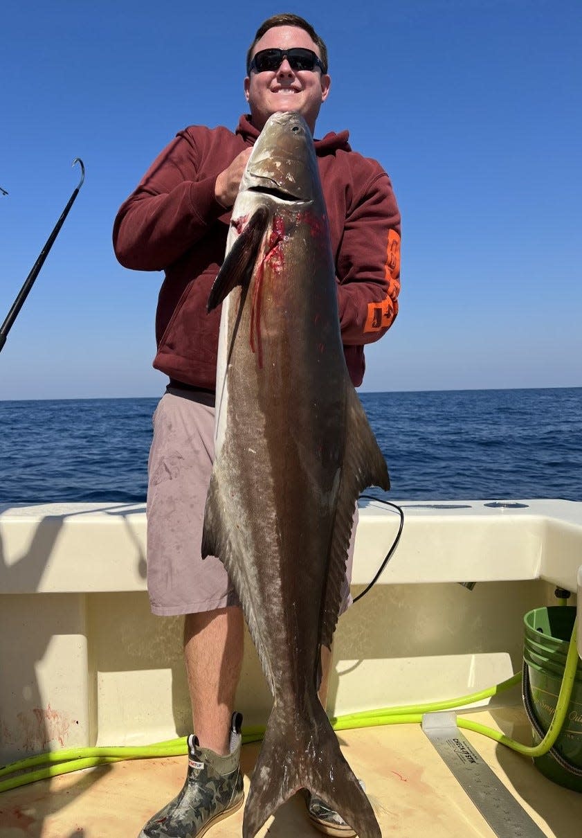 Capt. Cody Moore (New Smyrna Outfitters) with a 55-pound cobia he caught last week off Ponce Inlet.