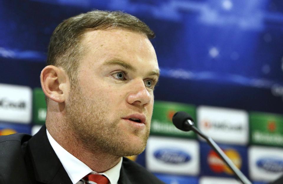 Manchester United's player Wayne Rooney attends a news conference at Georgios Karaiskakis stadium, in Piraeus port, near Athens, on Monday, Feb. 24, 2014. Manchester United will play against Olympiakos in the Champions League's round of 16 on Tuesday. (AP Photo/Thanassis Stavrakis)