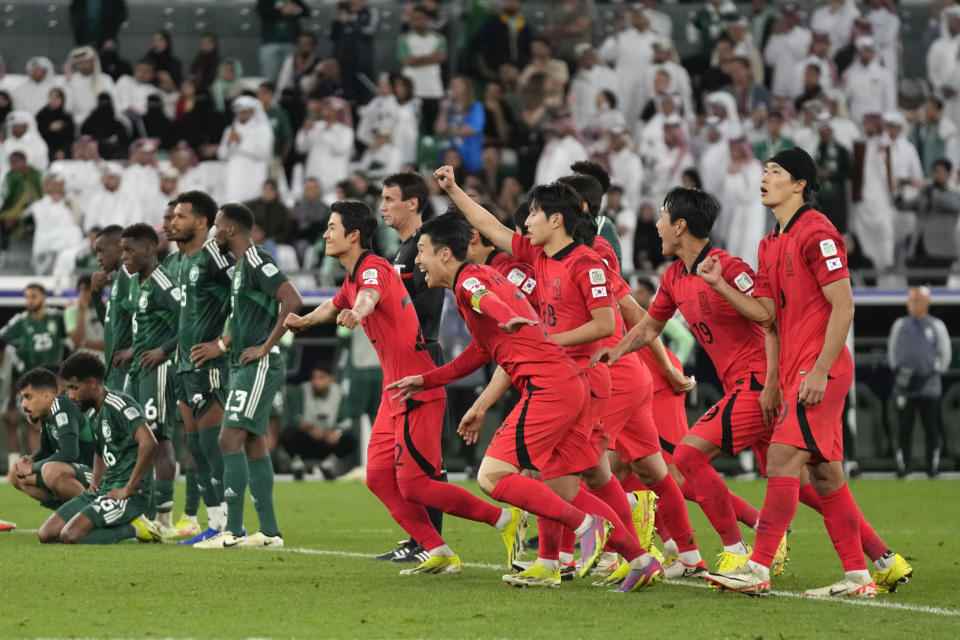 South Korea celebrates after winning the game in a penalty kick shoot-out during the Asian Cup round of 16 soccer match between Saudi Arabia and South Korea at Education City Stadium Al Rayyan, Qatar, Tuesday, Jan. 30, 2024. (AP Photo/Aijaz Rahi)