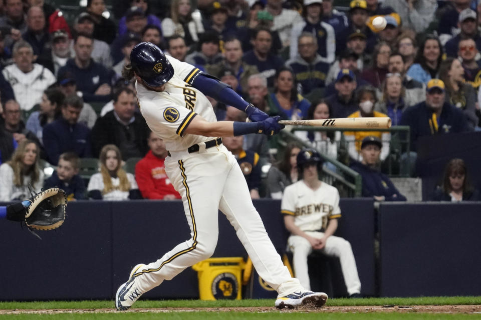 Milwaukee Brewers' Brian Anderson hits an RBI single during the fifth inning of a baseball game against the New York Mets Monday, April 3, 2023, in Milwaukee. (AP Photo/Aaron Gash)