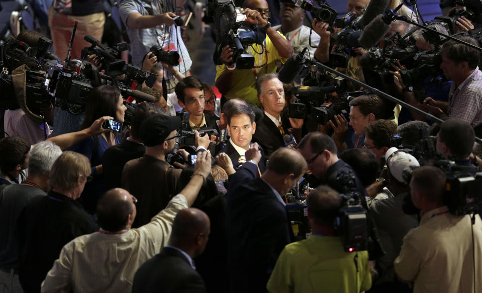 Sen. Marco Rubio, R-Fla., is surrounded by reporters during a tour of the convention floor at the Republican National Convention in Tampa, Fla., on Wednesday, Aug. 29, 2012. (AP Photo/J. Scott Applewhite)