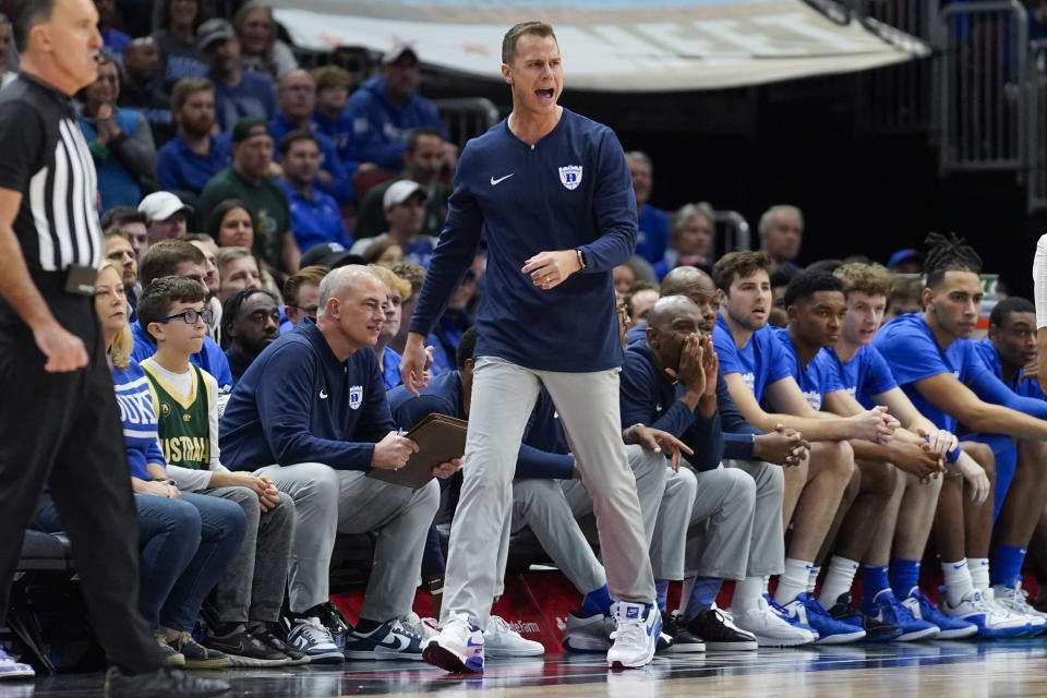 Duke head coach Jon Scheyer shouts from the sidelines during the first half of an NCAA college basketball game against Michigan State, Tuesday, Nov. 14, 2023, in Chicago. (AP Photo Erin Hooley)