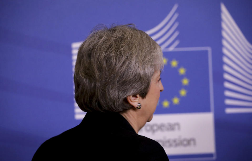 British Prime Minister Theresa May arrives for a meeting with European Commission President Jean-Claude Juncker at EU headquarters in Brussels, Wednesday, Feb. 20, 2019. European Commission President Jean-Claude Juncker and British Prime Minister Theresa May meet Wednesday for their latest negotiating session to seek an elusive breakthrough in Brexit negotiations. (AP Photo/Olivier Matthys)