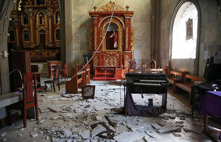 Debris and rubble are pictured inside the Santa Catalina de Alejandria Parish after an earthquake the day before in Porac town, Pampanga province, Philippines, April 23, 2019. REUTERS/Eloisa Lopez