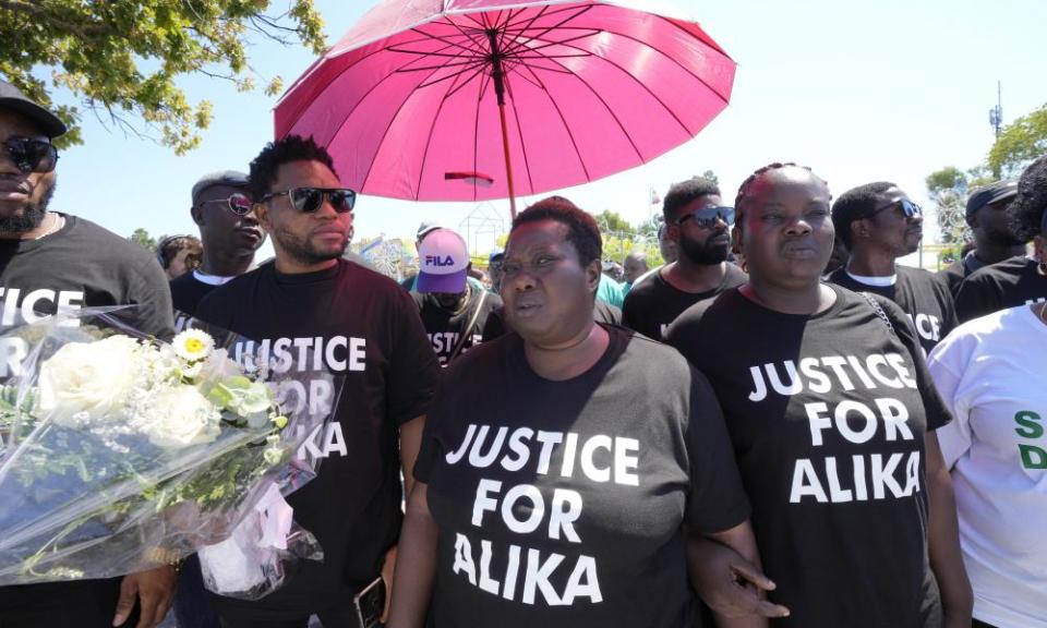 Charity Oriakhi (centre), the widow of street vendor Alika Ogorchukwu, at a demonstration on Saturday 