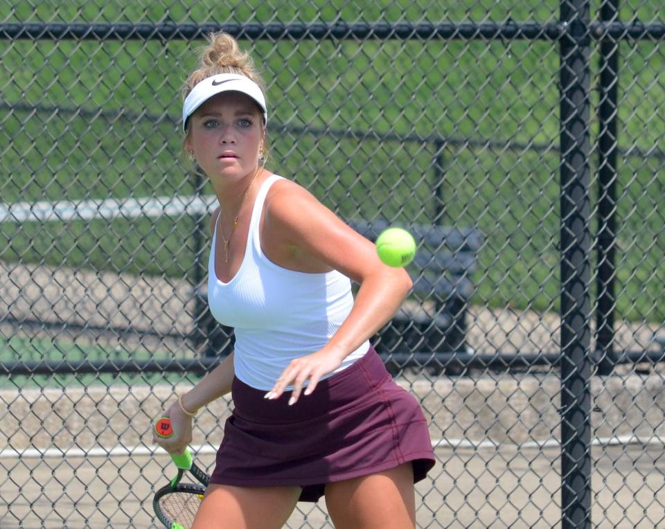 Holland Christian's Hope Rhoades returns a shot during the OK Blue Conference finals on Friday at Holland Christian.