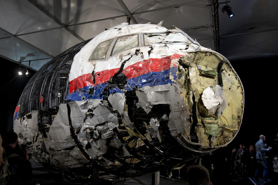 FILE - This Tuesday, Oct. 13, 2015 file photo, shows the reconstructed wreckage of Malaysia Airlines Flight MH17, put on display during a press conference in Gilze-Rijen, central Netherlands. United by grief across oceans and continents, families who lost loved ones when Malaysia Airlines Flight 17 was shot down in 2014 hope that a trial starting next week will finally deliver them something that has remained elusive ever since: The truth. (AP Photo/Peter Dejong, File)