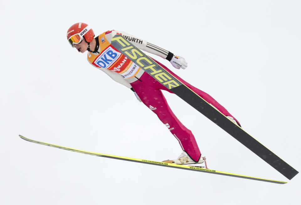 World Cup leader Eric Frenzel of Germany soars through the air during the individual Gundersen competition at the Nordic Combined FIS World Cup in Oberstdorf, southern Germany, Sunday, Jan. 26, 2014. He placed third after the jumping. (AP Photo/Jens Meyer)