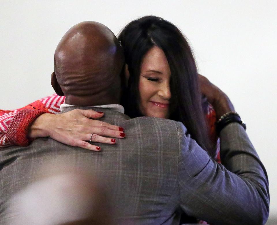 Melissa Najda, facing, hugs her uncle Nate Thurmond’s former teammate Campy Russell, during the 2023 Akron Public Schools Athletics Hall of Fame induction ceremony Saturday at House Three Thirty in Akron.