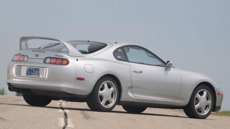 A photo of a silver Toyota Supra coupe. 