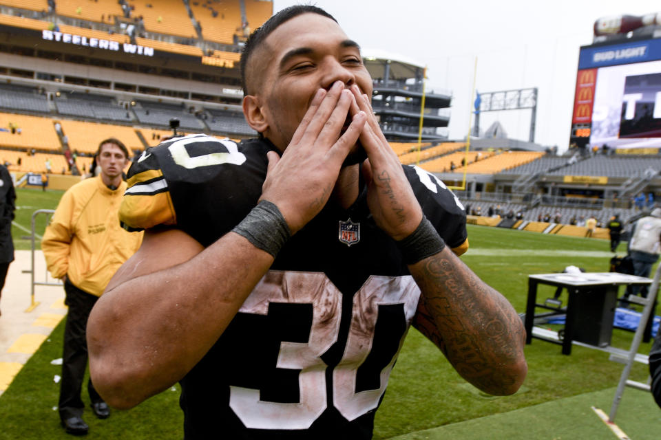 Steelers running back James Conner (30) acknowledges fans as he leaves the field after helping beat the Browns. (AP)