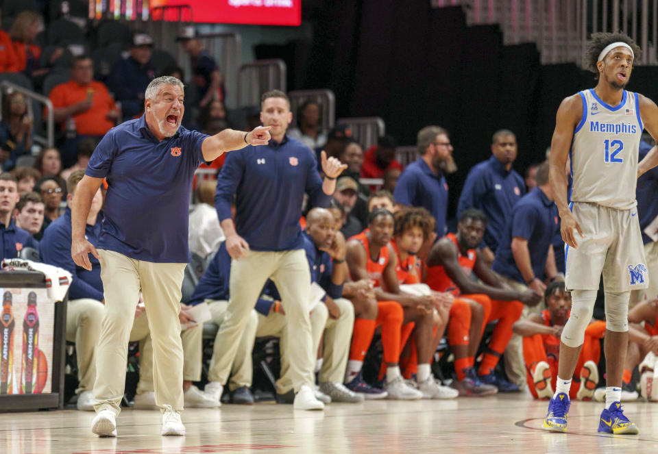 Auburn head coach Bruce Pearl disputes a call during the first half of an NCAA college basketball game against Memphis, Saturday, Dec. 10, 2022, in Atlanta. (AP Photo/Erik Rank)