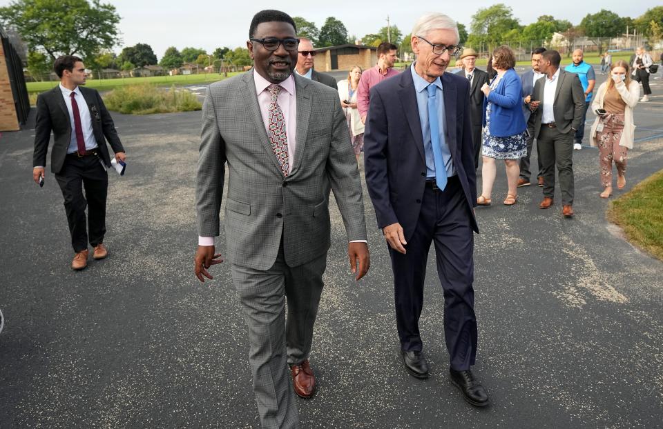 Milwaukee Public School Superintendent Keith P. Posley, left, and Gov. Tony Evers take a tour Sept. 26  at the Academy of Accelerated Learning in Milwaukee on the first day of school for Milwaukee Public Schools.