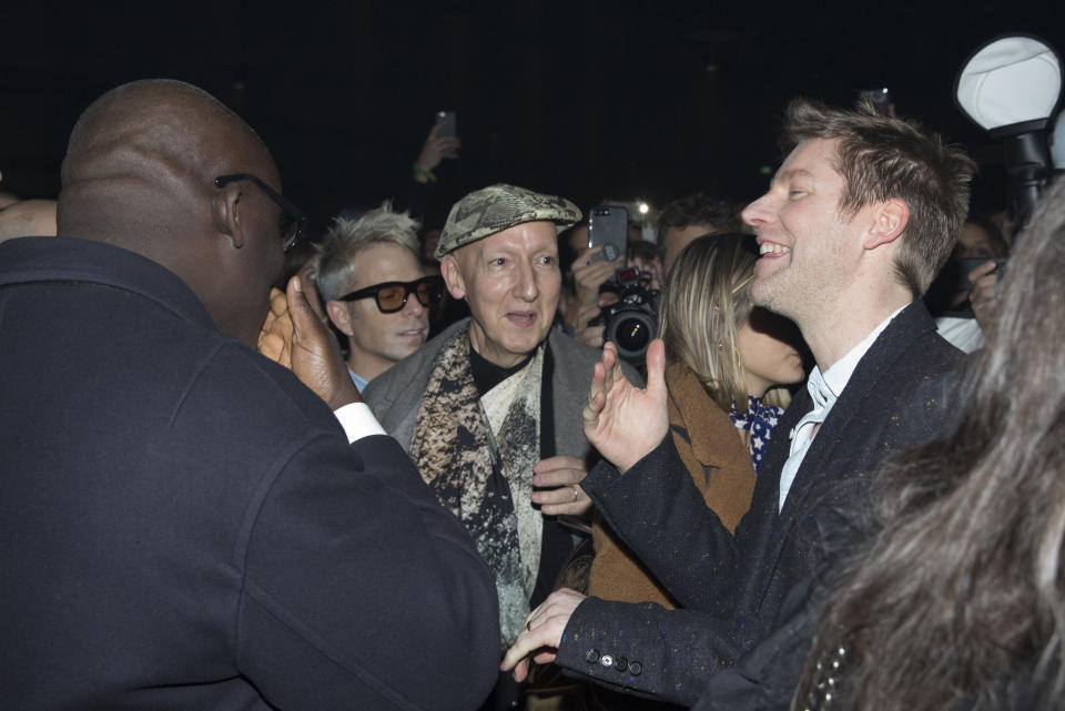 Burberry creative director and former CEO Christopher Bailey speaks with Vogue editor Edward Enninful (left) as they attend the Burberry Autumn/Winter 2018 London Fashion Week show at the Dimco Buildings in west London.