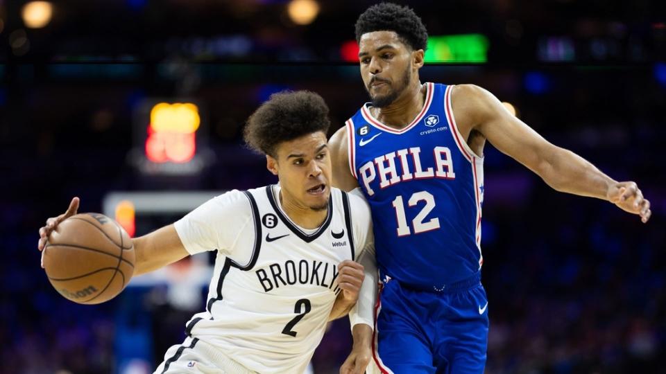 Apr 17, 2023; Philadelphia, Pennsylvania, USA; Brooklyn Nets forward Cameron Johnson (2) drives against Philadelphia 76ers forward Tobias Harris (12) during the first quarter in game two of the 2023 NBA playoffs at Wells Fargo Center.