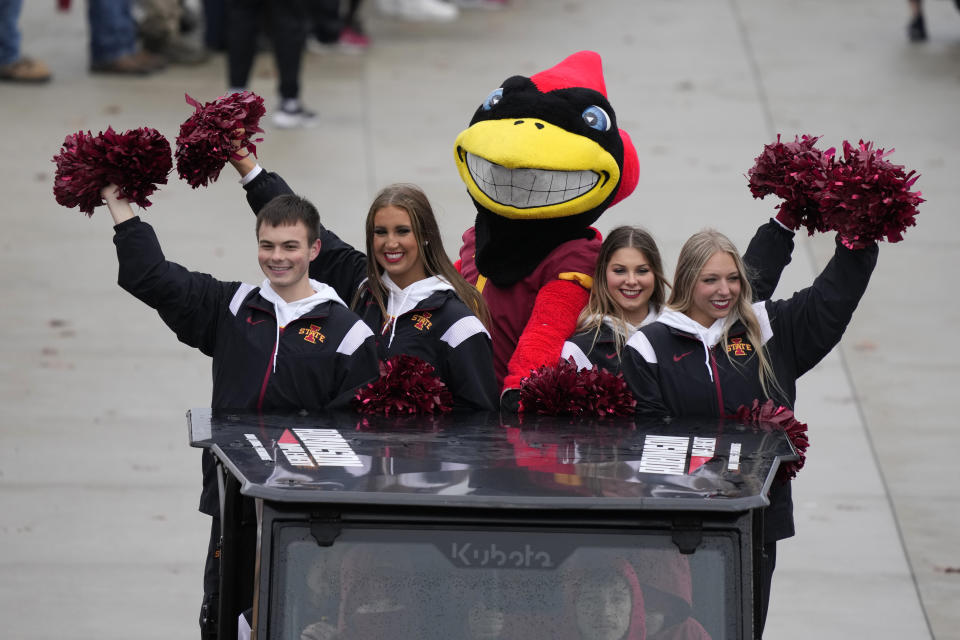 Iowa State cheerleaders arrive at Jack Trice Stadium before an NCAA college football game against West Virginia, Saturday, Nov. 5, 2022, in Ames, Iowa. College athletic programs of all sizes are reacting to inflation the same way as everyone else. They're looking for ways to save. Travel and food are the primary areas with increased costs. (AP Photo/Charlie Neibergall)