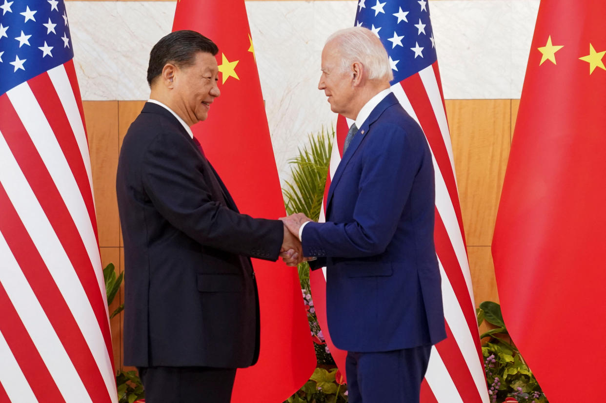 U.S. President Joe Biden shakes hands with Chinese President Xi Jinping as they meet on the sidelines of the G20 leaders' summit in Bali, Indonesia, November 14, 2022.  REUTERS/Kevin Lamarque