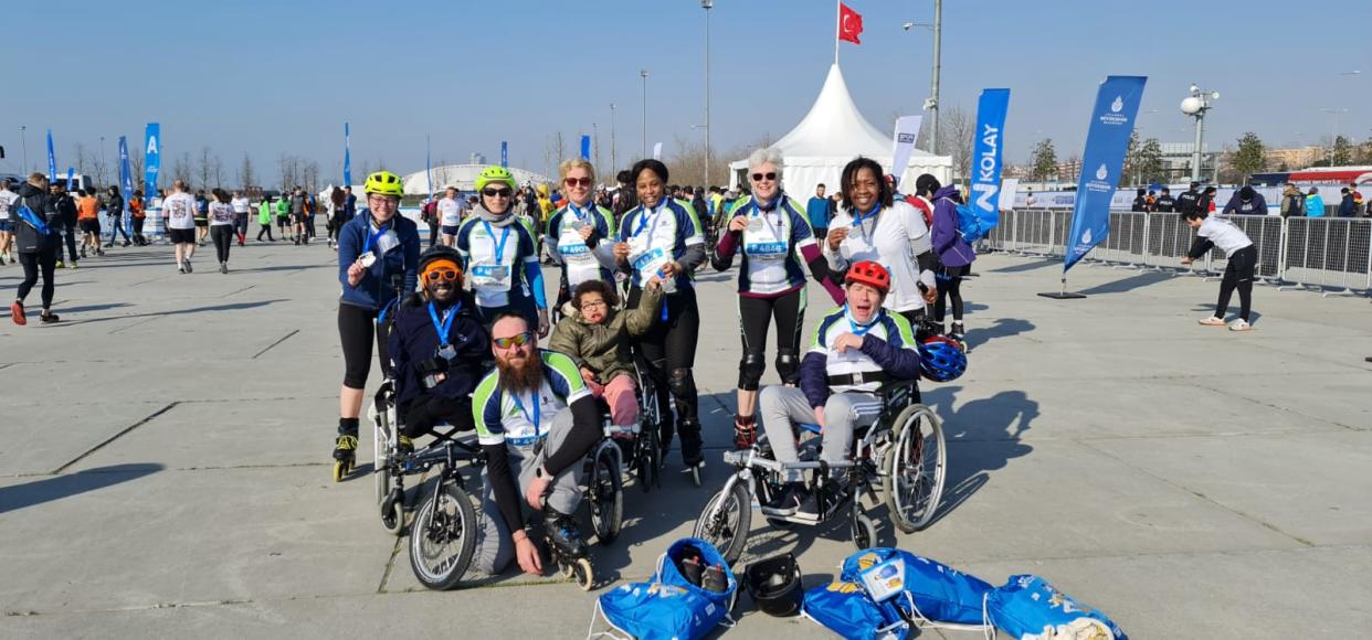 Group of people with skates standing together