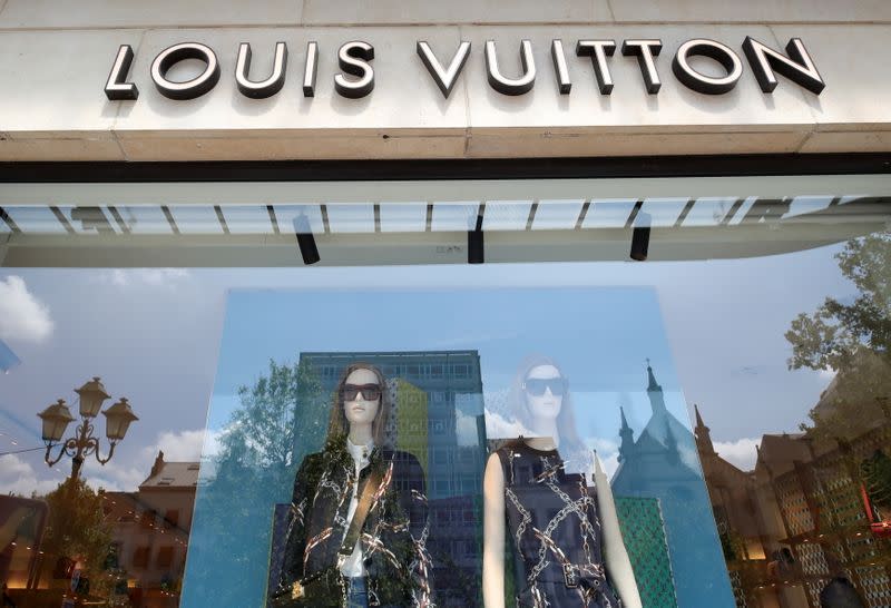 FILE PHOTO: A logo of luxury goods company Louis Vuitton is seen at the entrance of a shop in Brussels