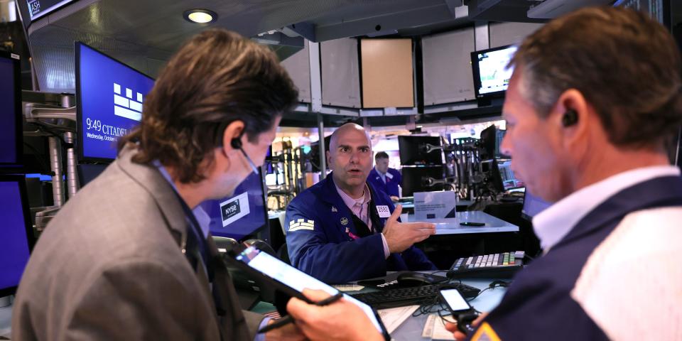 Traders work the floor of the New York Stock Exchange in October 2023