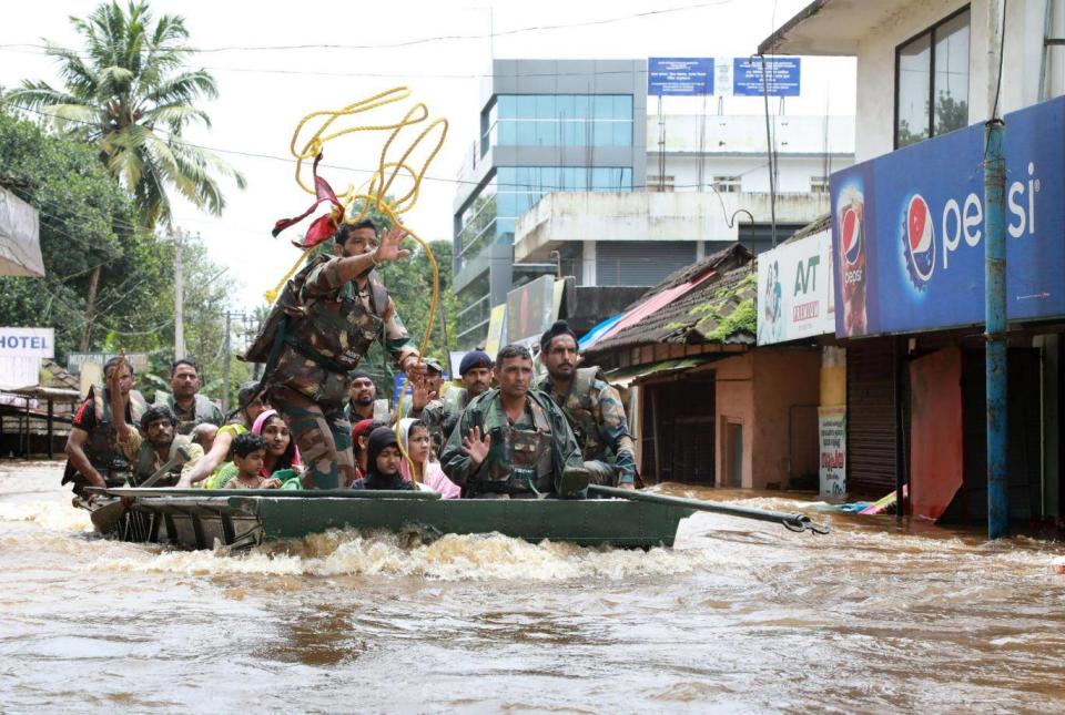 Indian army personal evacuate local residents (AFP/Getty)