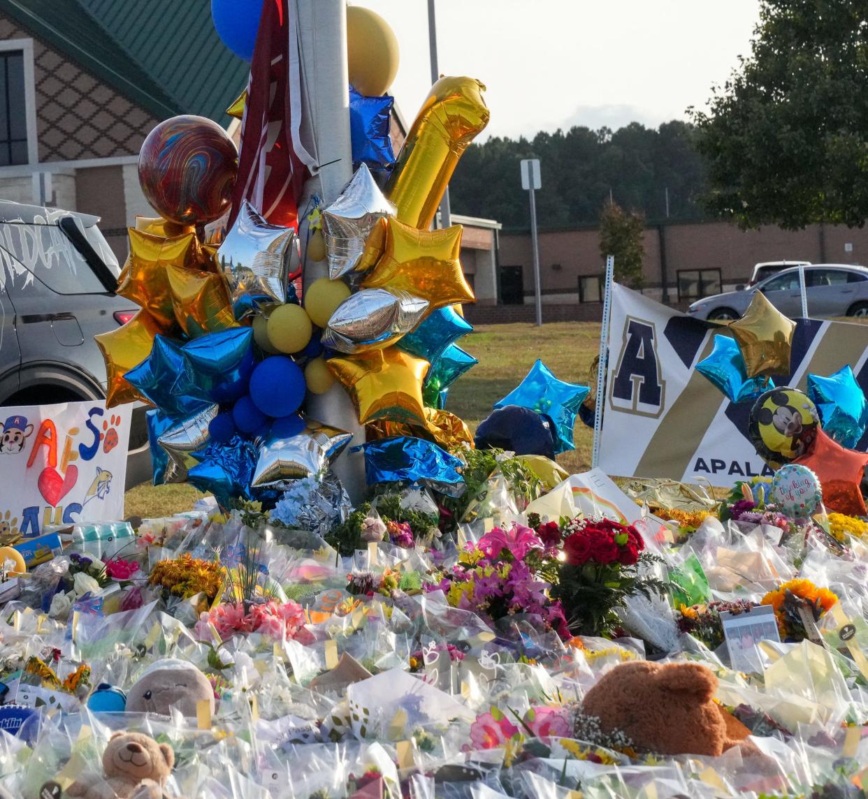 Mourners gather at Apalachee High School in Barrow County, Georgia, the evening before classes resumed across the district, less than a week after two teachers and two students were gunned down, investigators say, by a 14-year-old student.