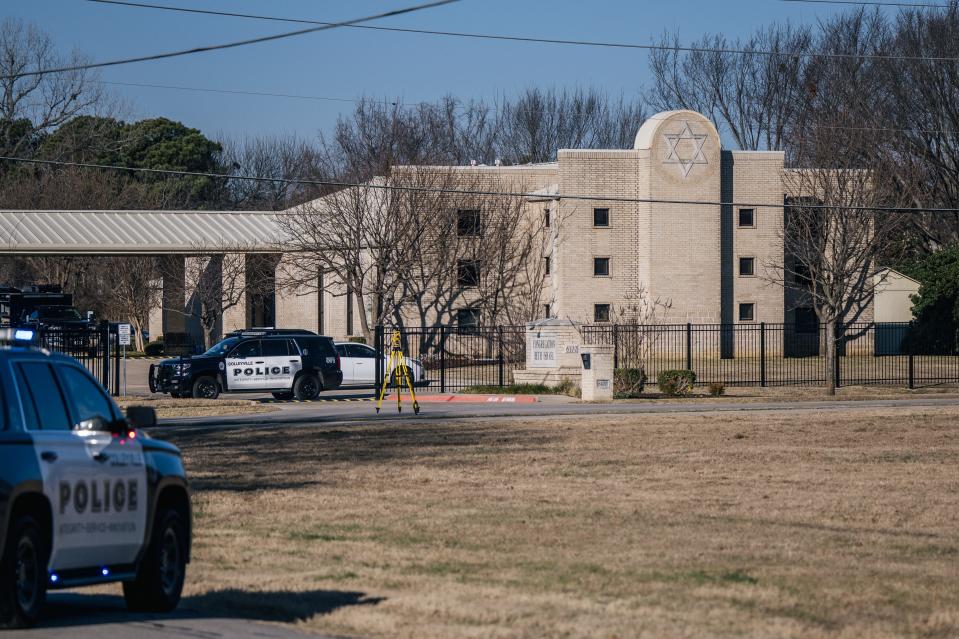 In this January 2022 photo, law enforcement vehicles sit in front of the Congregation Beth Israel synagogue where four people were held hostage. 
(Photo: Brandon Bell, Getty Images)