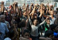 Migrants from several countries demonstrate against the Hungarian migration policy in front of the Keleti railway station in Budapest on August 30, 2015