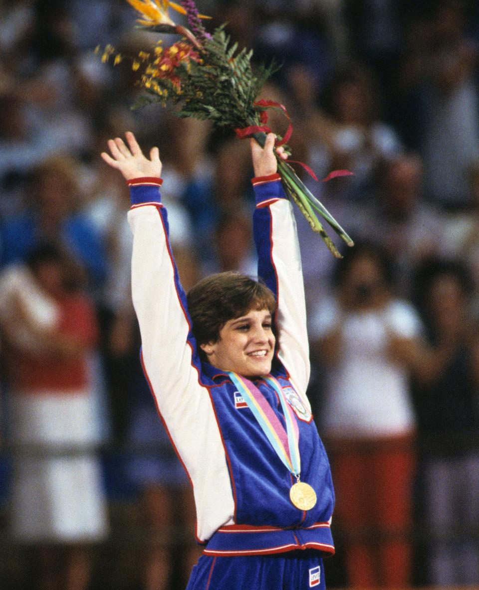 Mary Lou Retton celebrates her gold medal at the 1984 Summer Olympics in Los Angeles.