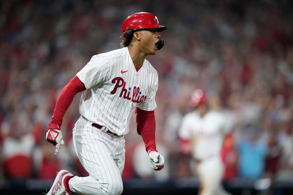 Philadelphia Phillies' Cristian Pache reacts after hitting an RBI-single against Miami Marlins pitcher Jesus Luzardo during the fourth inning of Game 1 in an NL wild-card baseball playoff series, Tuesday, Oct. 3, 2023, in Philadelphia. (AP Photo/Matt Slocum)
