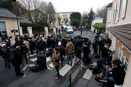 Journalists work in front of late French singer and actor Johnny Hallyday's home in Marnes-la-Coquette near Paris, France December 6, 2017. REUTERS/Benoit Tessier