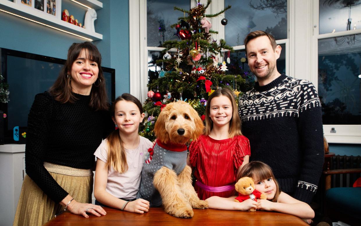 Fiona Cowood with James Ross and their children Daphne, 11, Olive, 8, and Daisy, 5 with their greedy goldendoodle Calli