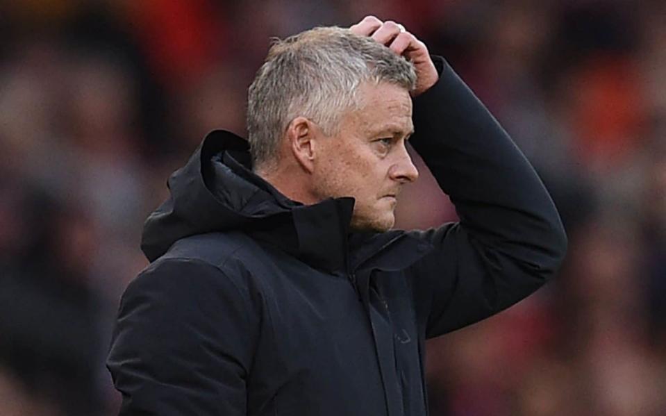 Ole Gunnar Solskjaer appears at a loss during a first half in which his side conceded FOUR goals to Liverpool - AFP/Getty