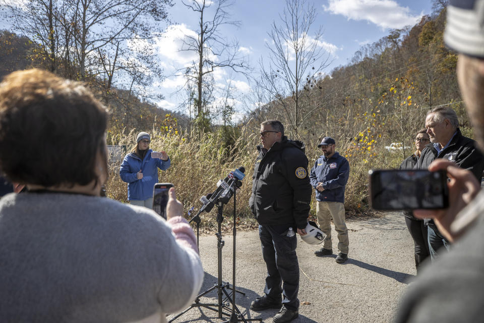 Lexington Fire Department Battalion Chief Chris Ward speaks to members of the media about the rescue operation underway for a worker trapped inside a collapsed coal preparation plant in Martin County, south of Inez, Ky., on Wednesday, Nov. 1, 2023. One worker was confirmed dead. (Ryan C. Hermens/Lexington Herald-Leader via AP)