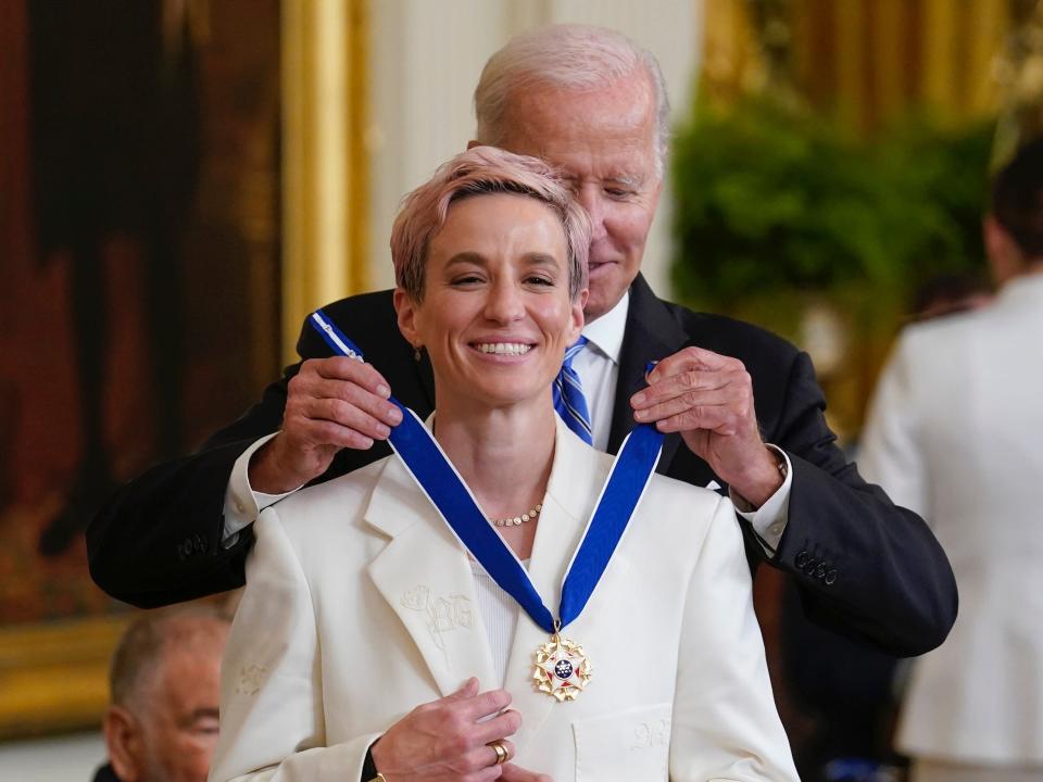 Megan Rapinoe receives her Presidential Medal of Freedom from President Joe Biden.