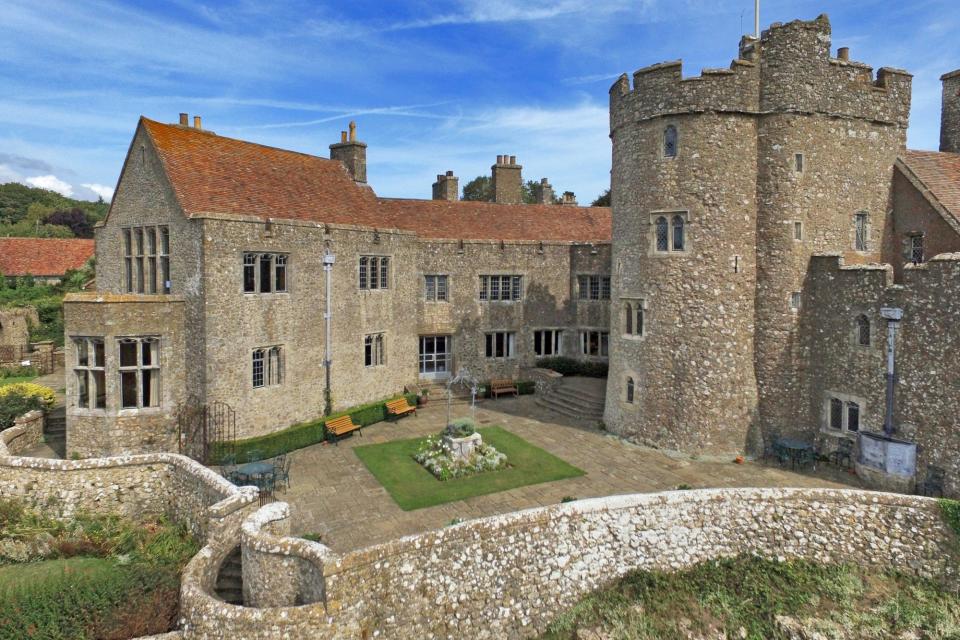 An exterior view of Lympne Castle, featuring one of its towers.