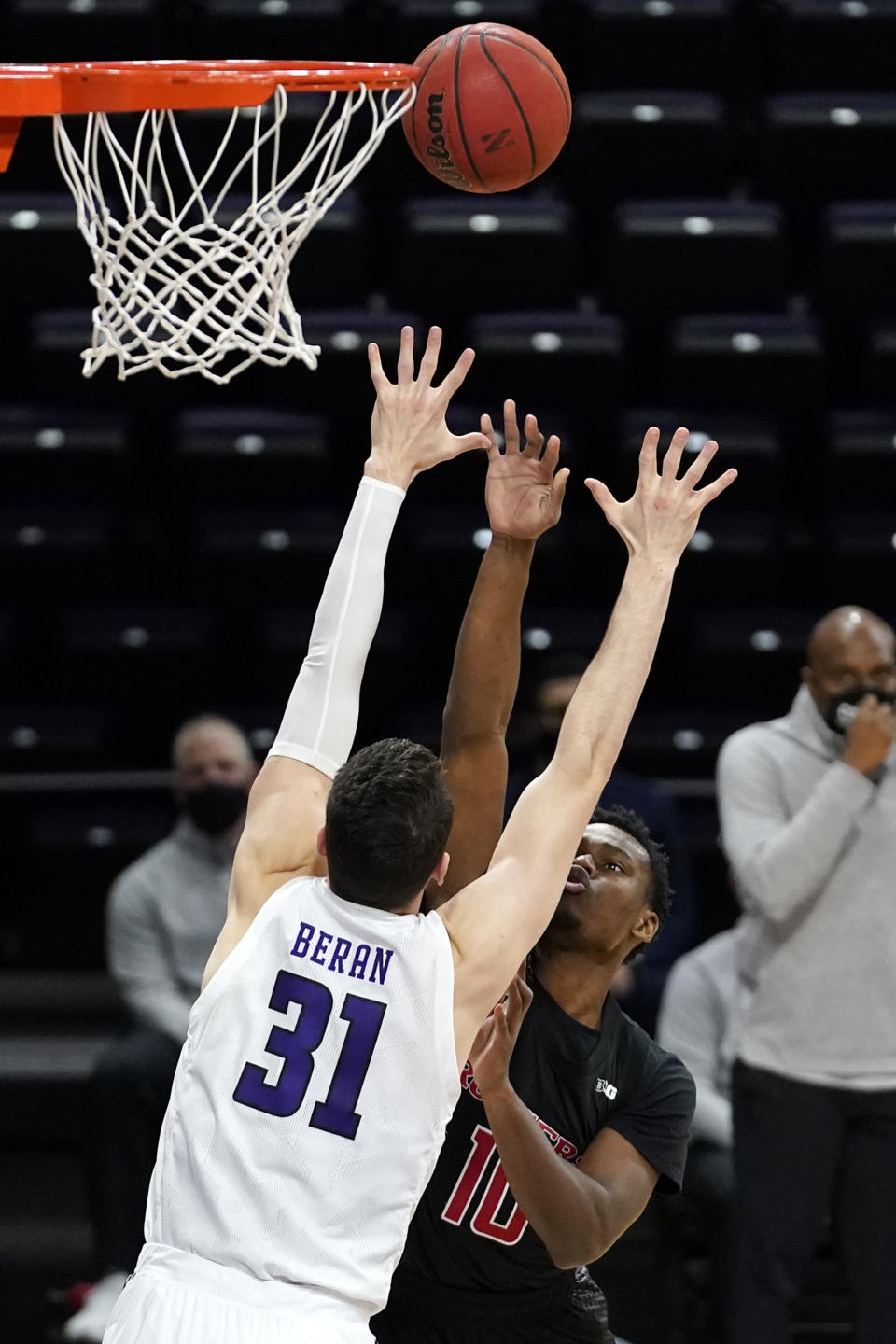 Rutgers guard Montez Mathis, right, shoots against Northwestern forward Robbie Beran during the first half of an NCAA college basketball game in Evanston, Ill., Sunday, Jan. 31, 2021. (AP Photo/Nam Y. Huh)
