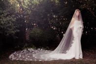 <p>Dress with long veil petal train. (Photo: Honor) </p>