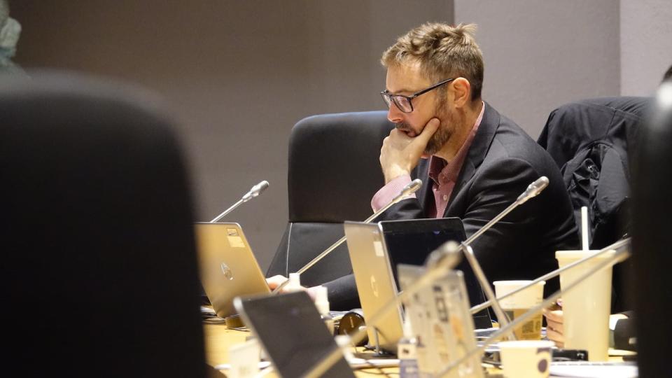 Capital ward Coun. Shawn Menard checks something on his computer during a committee meeting on Nov. 3, 2023.