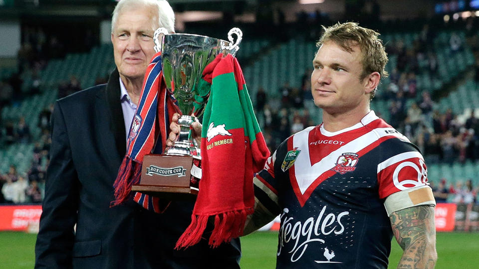 Ron Coote and Roosters captain Jake Friend, pictured here with the Ron Coote Cup in 2015.