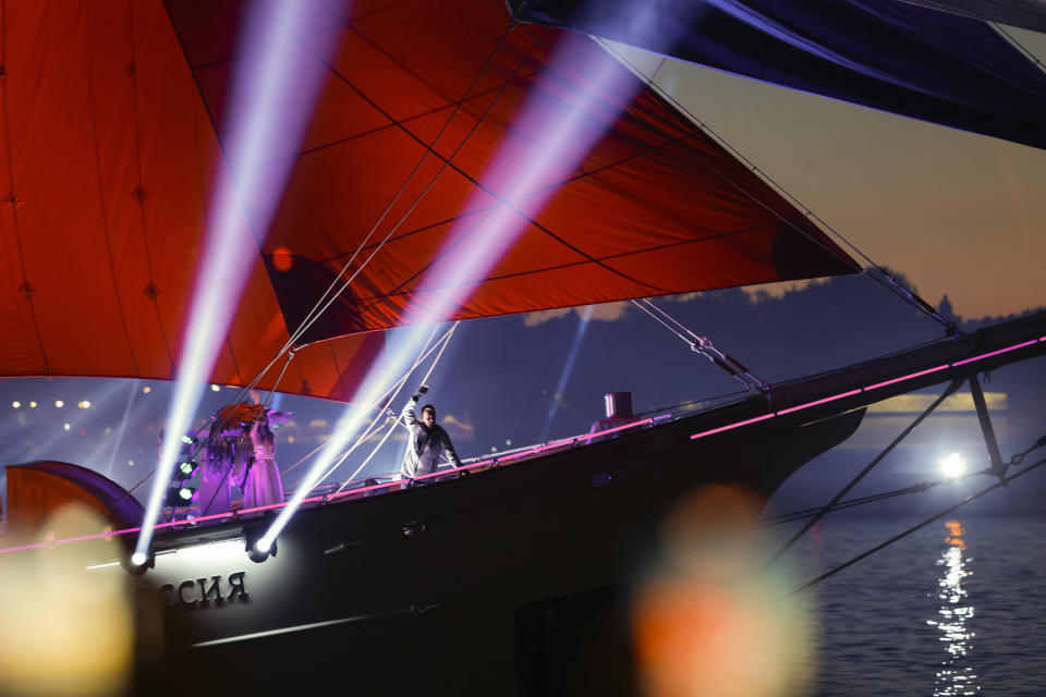 A brig with scarlet sails, sailing on the Neva River during the Scarlet Sails festivities marking school graduation in St. Petersburg, Russia, early Saturday, June 25, 2022. (AP Photo/Elena Ignatyeva)