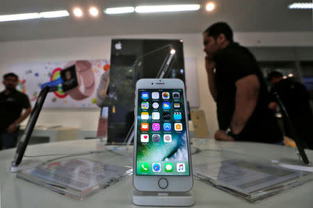 An iPhone is seen on display at a kiosk at an Apple reseller store in Mumbai, India, January 12, 2017. Picture taken January 12, 2017. REUTERS/Shailesh Andrade