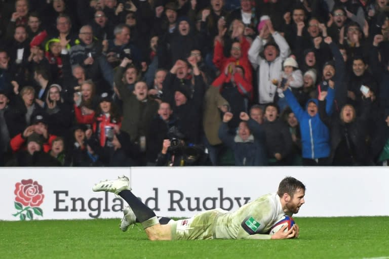 England's wing Elliot Daly scores the first try of the game during their match against Australia at Twickenham stadium in south-west London on November 18, 2017